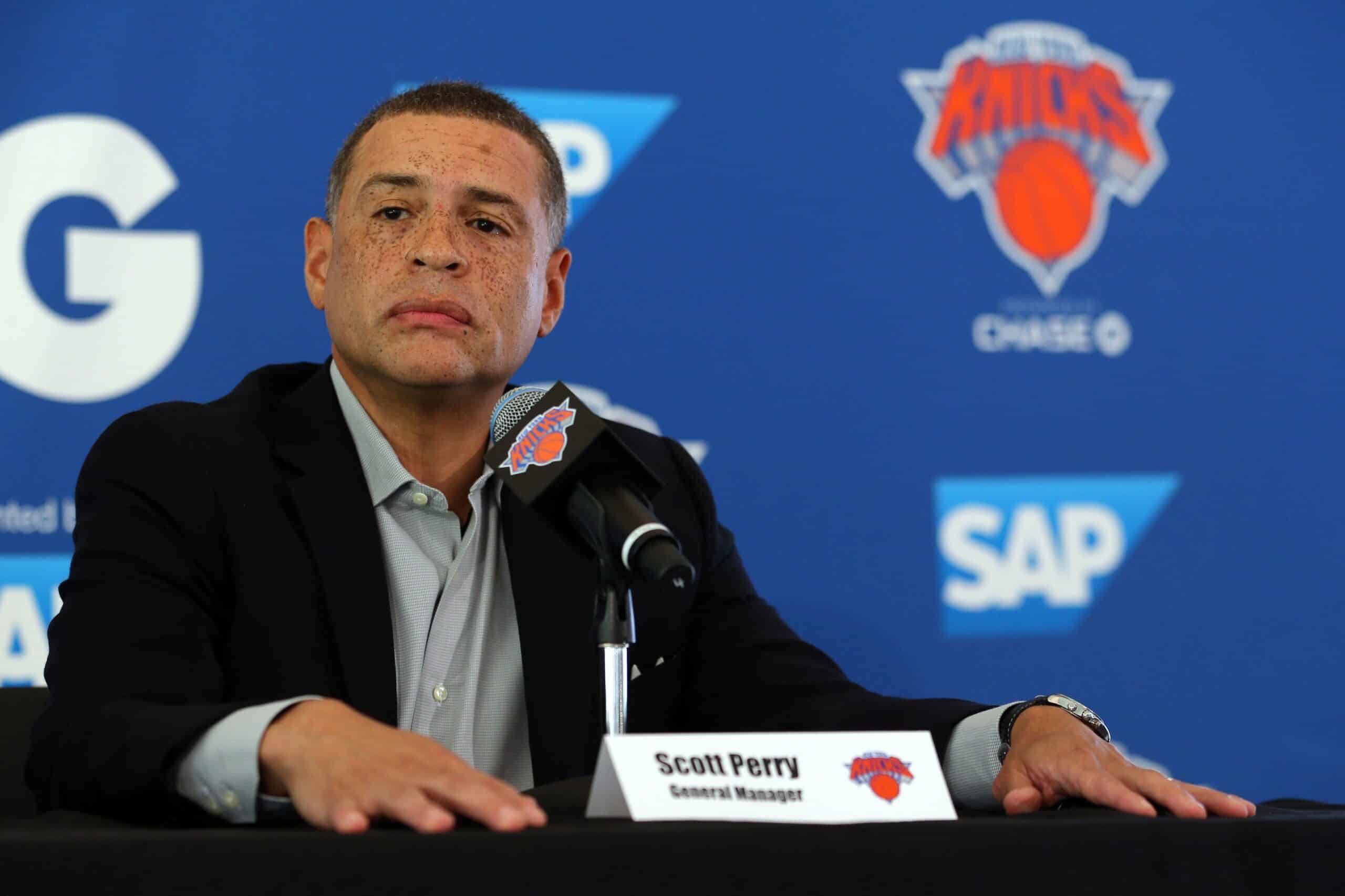Scott Perry sitting at a press conference Knicks